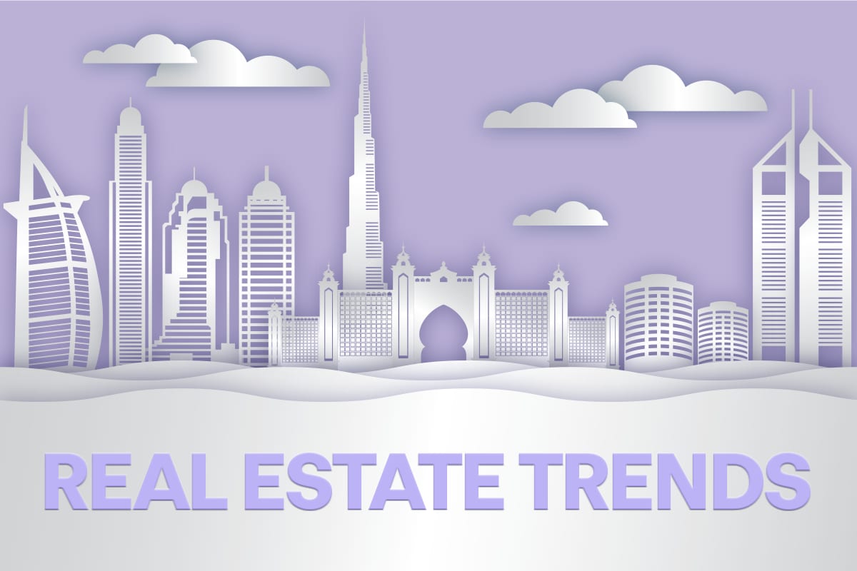 Paper-cut Dubai skyline with the Burj Khalifa and Burj Al Arab above the words “Real estate trends”