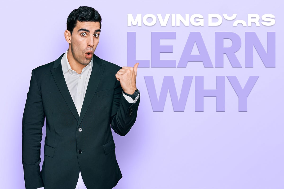 Surprised man in a suit pointing at the words “Moving Doors – Learn why”