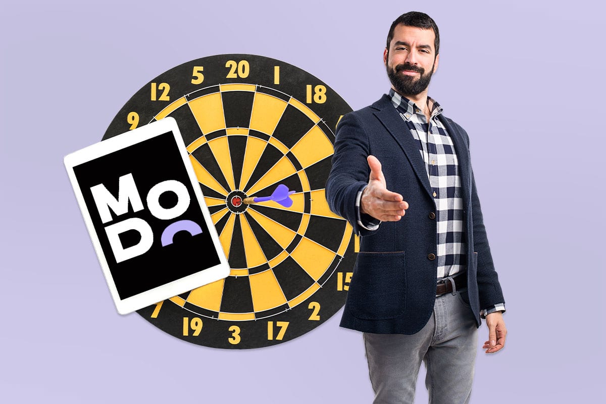 Smiling man offering a handshake beside a dartboard and a tablet showing the Moving Doors logo